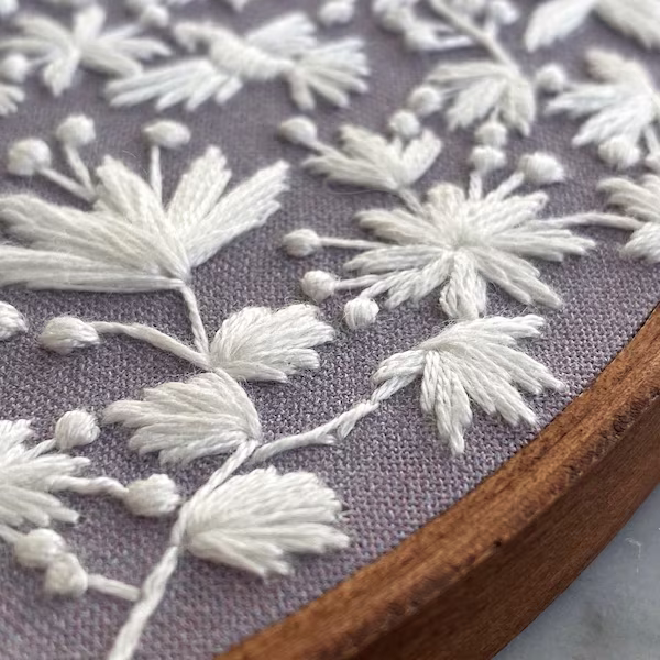 Ornamental decorative embroidery worked in several thread colours