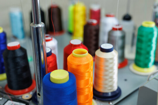 Embroidery machine stitching a detailed design into fabric